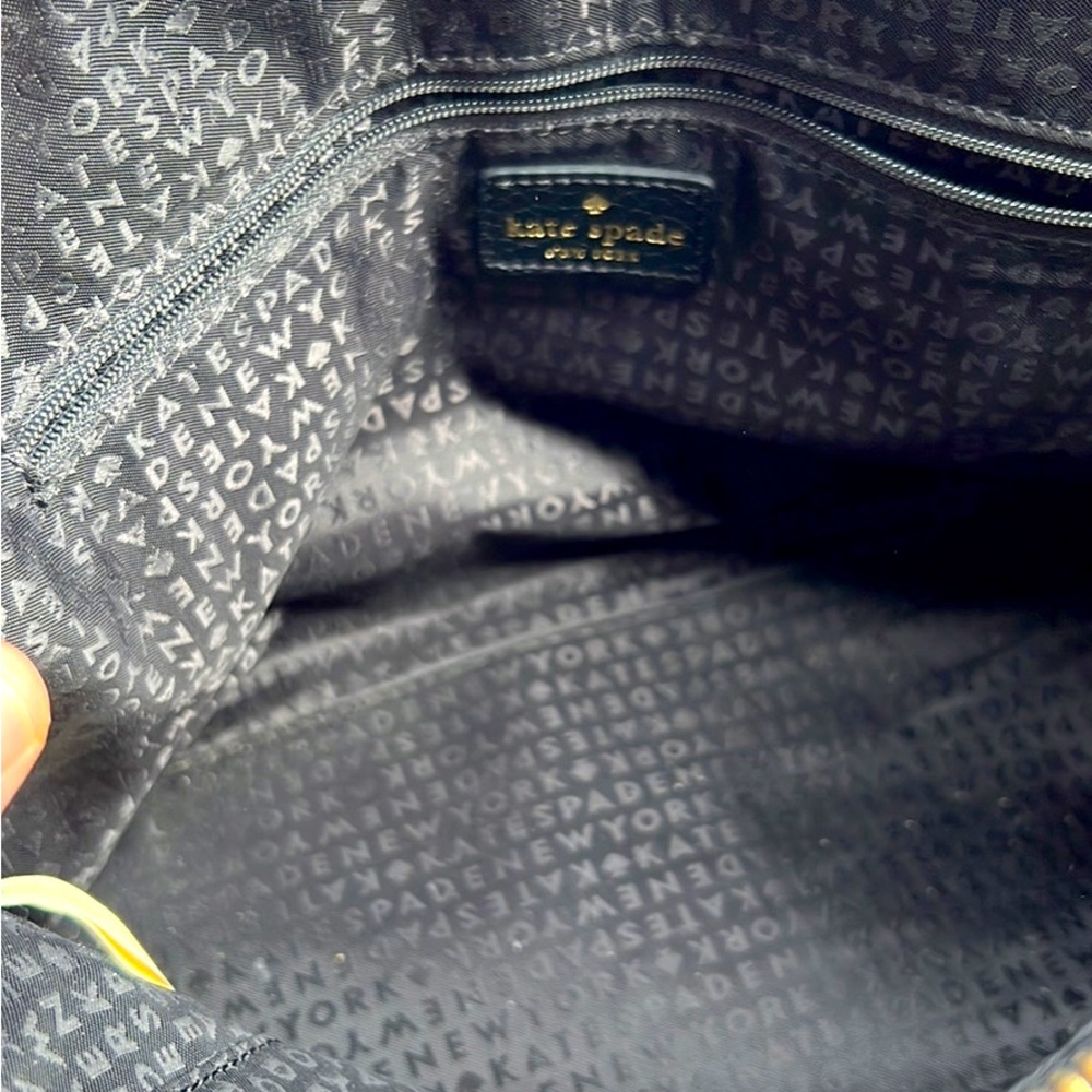 Kate Spade purse in great condition. The color is black. It has a strap.
